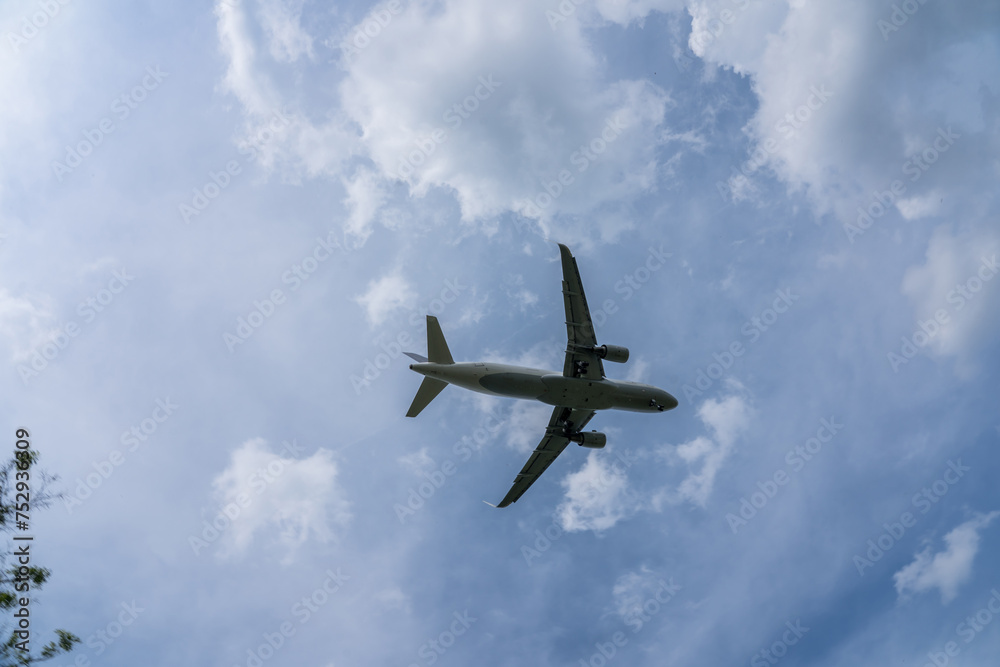 Underside view of airplane taking off Underside view of airplane taking off
