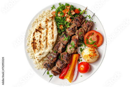 top view of Adana kebab, a Turkish dish featuring minced lamb or beef skewers, served with grilled vegetables, rice, and flatbread.