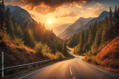 A beautiful scenic road among mountains and forests on the background of sunset. The road to sunset. The natural beauty of the planet