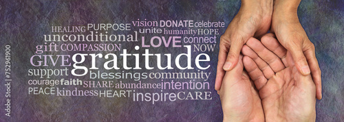 Фотография Words associated with giving love and gratitude - female hands cupped around mal