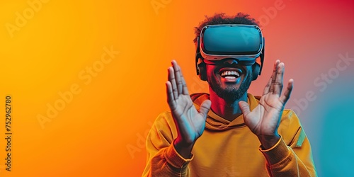 Person wearing VR headset in a studio. A person enjoys a virtual reality experience, arms raised, immersed in the digital world, against a vibrant backdrop