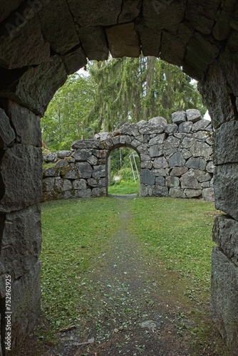 Fototapeta Naklejka Na Ścianę i Meble -  Old stone ruins at Kaupunginpuisto park in forest in summer, Hämeenlinna, Finland.