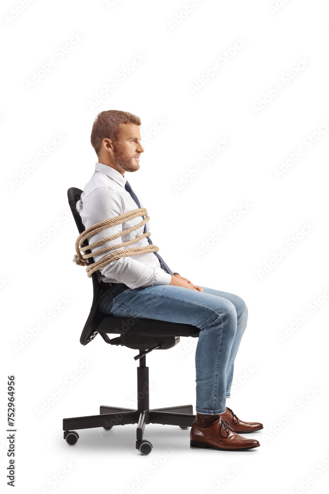 Profile shot of a male office worker tied to a chair with a rope Profile shot of a male office worker tied to a chair with a rope