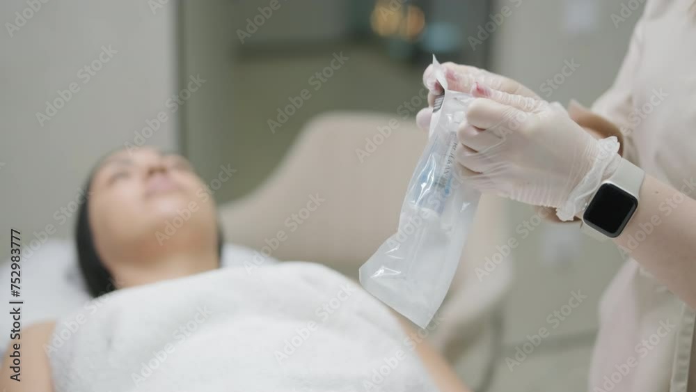 Woman making botulinum therapy in modern cosmetology clinic close up. Professional cosmetologist doing injection with botulinum toxin for rejuvenation face skin.