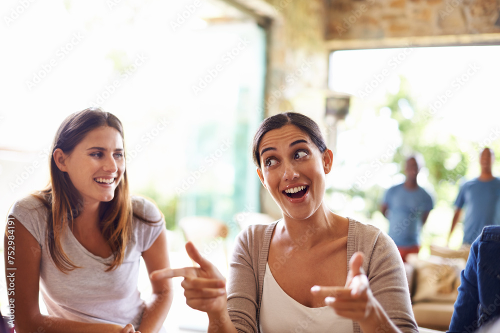 Smile, funny face and conversation with friends in restaurant together for social gathering or bonding. Happy, facial expression and hand gesture with woman talking to group of people in coffee shop