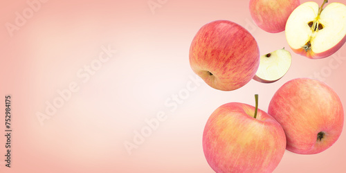 Pink Fuji apple flying in the air isolated on pink color background. Copy space for text. photo