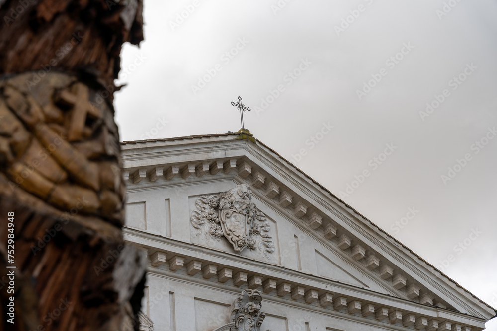 A large white building with a cross on top