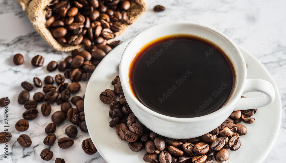 Black coffee and coffee beans on a white marble table. Black coffee and coffee beans on a white marble table.