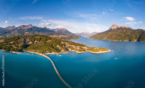 Summer aerial view of Serre-Poncon Lake with Chanteloube Bay and its submerged viaduct. Durance Valley with Grand Morgon peak in Hautes-Alpes (Alps), France photo