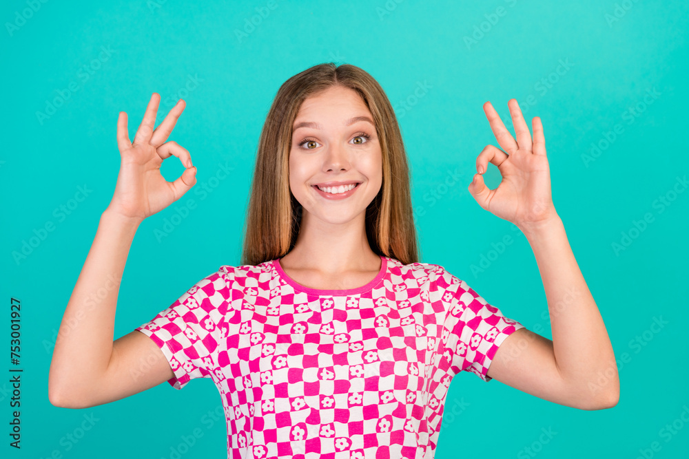 Photo portrait of lovely teen lady show excited double v-sign wear trendy print pink garment isolated on cyan color background Photo portrait of lovely teen lady show excited double v-sign wear trendy print pink garment isolated on cyan color background