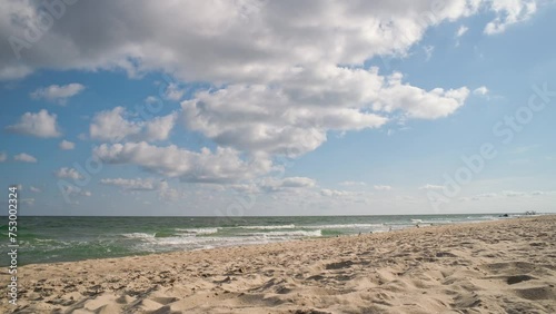 Time lapse of a seascape with sandy beach and seagulls on the Black Sea coast. Kurortne, Odessa region, Ukraine. photo