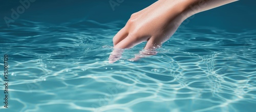 Exploring the Unknown: Hand Dips into Mysterious Pool Water Creating Ripples of Discovery