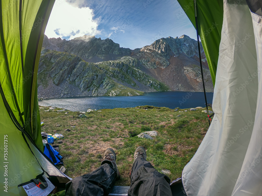 camping in the mountains with the view to the lake
