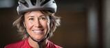 Confident Female Cyclist Smiling Happily in Her Protective Helmet Outdoors