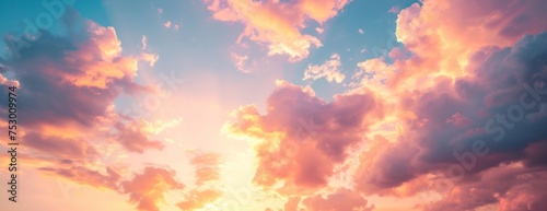 sunset sky in the morning with sunrise and soft pink clouds with yellow tones  #753009974