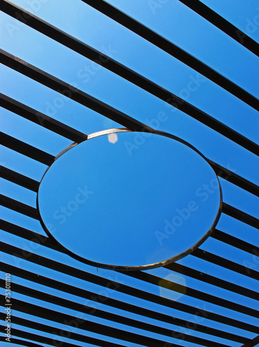 Iron ornaments against blue sky background. 