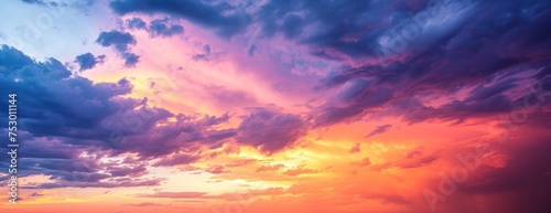 sunset sky clouds in the evening with red orange yellow and purple sunlight on golden hour after  © Oleg