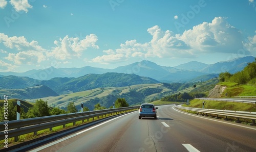 Open road with a scenic photo of a car driving on a European highway, surrounded by beautiful summer landscapes © AlfaSmart