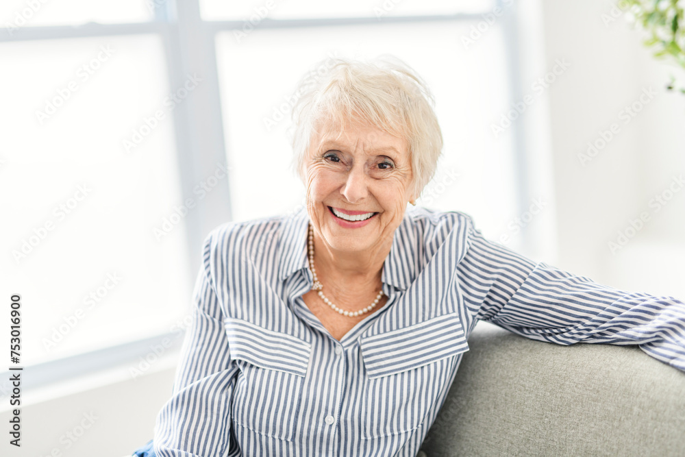 Smiling mature grey senior woman looking at camera Smiling mature grey senior woman looking at camera
