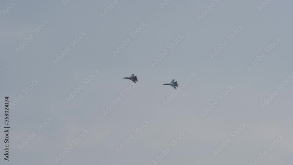 Military aircraft, combat fighters in the sky overhead. Parade of military equipment, air show Military aircraft, combat fighters in the sky overhead. Parade of military equipment, air show