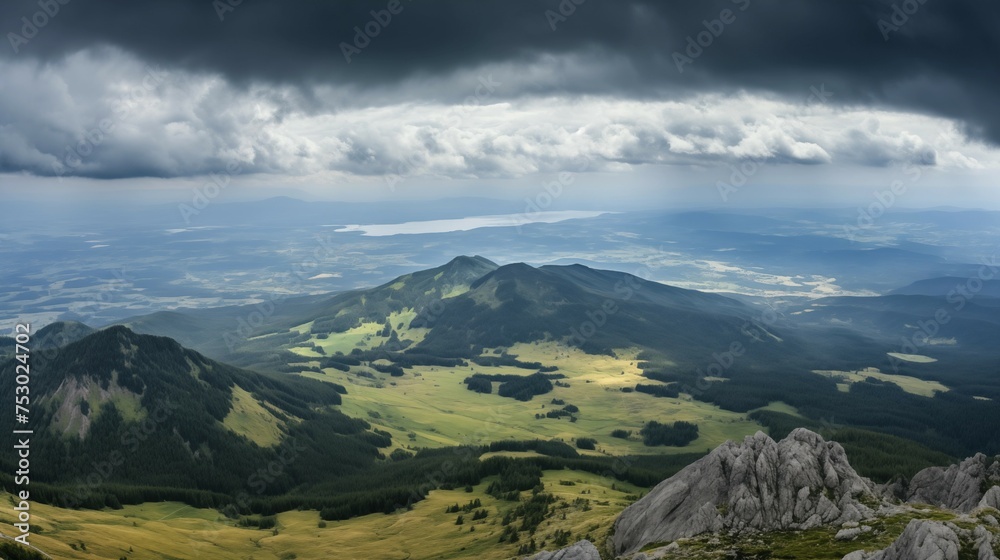Fototapeta premium Beautiful View of Mountains. top view, sky, clouds, green meadows
