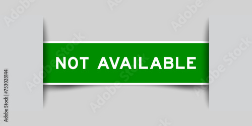 Green color square label sticker with word not available that inserted in gray background