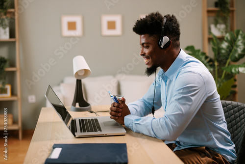 Young business man having a video call via laptop