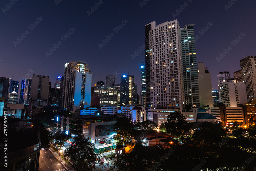 Makati, Philippines - Stunning nighttime skyline of the Makati CBD as seen from Legasp Village. Makati, Philippines - Stunning nighttime skyline of the Makati CBD as seen from Legasp Village.