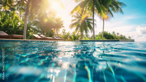Swimming Pool With Sunlight Filtering Through Palm Trees