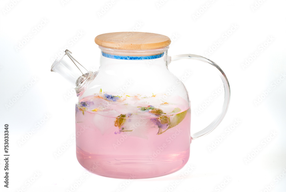 Fruit and herb drink in a glass pot