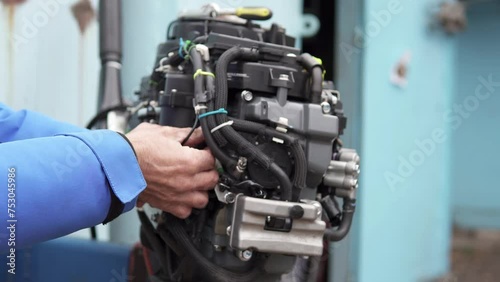 The master performs comprehensive diagnostics and repairs of injection outboard motors.	
 photo