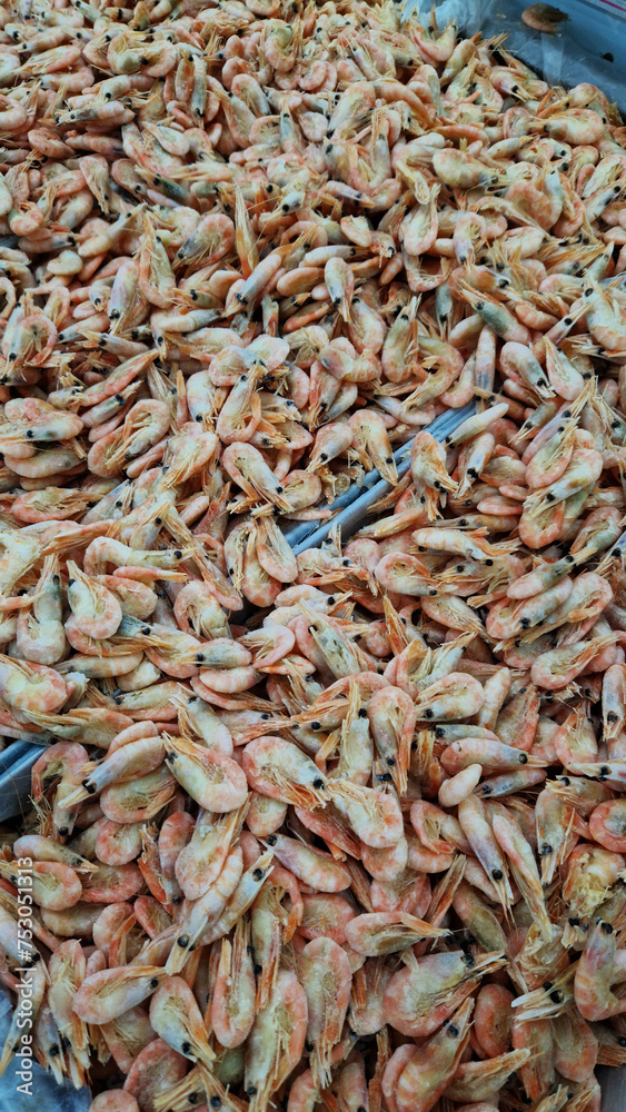 Frozen boiled shrimp in a supermarket or grocery store, close-up. Seafood Frozen boiled shrimp in a supermarket or grocery store, close-up. Seafood