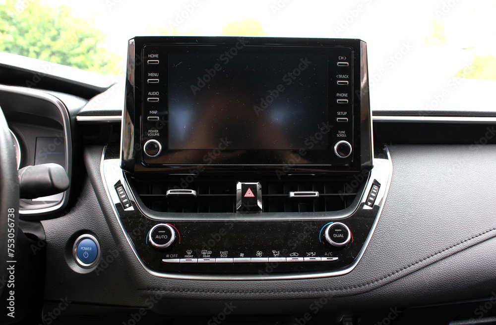 Fototapeta premium Modern car Screen multimedia system. Panel of a modern car. Interior of a modern luxury car. Modern car dashboard.