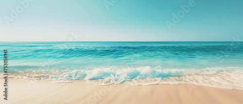 Serene Beach with Turquoise Waters and Clear Sky  The serene scene of a beach with gentle turquoise waters under a clear sky invokes a feeling of peace and relaxation.