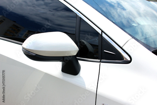 Rear-view mirror. Rear view mirror modern white car. Wing mirror of a modern car. White side mirror car. Back view. Rear-view mirror moder car. 