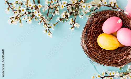 Happy easter, Easter painted eggs in the basket on wooden rustic table for your decoration in holiday. copy space.