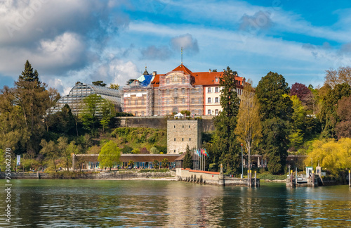 Lovely panoramic view of the medieval Comturey tower and the habour of the famous island Mainau in Lake Constance (Bodensee), Germany. Above are the Teutonic castle with the palm house. photo