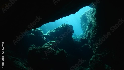 scuba divers exploring caves underwater cave diving photo