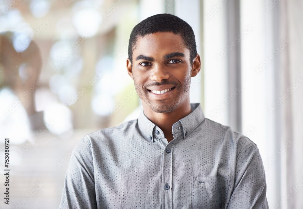 Happy black man, portrait and window with confidence or ambition for career, job or creative startup at office. Face of African male person or employee with smile for expertise or positive attitude