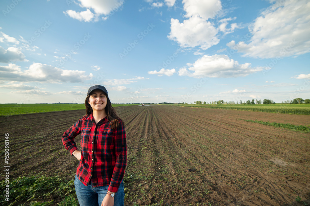 Portrait of young woman in country field