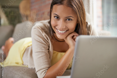 Portrait, woman or laptop on sofa to search, internet or website for social media browsing. Female person, smile or computer on couch for checking email, reading blog or online surfing in living room