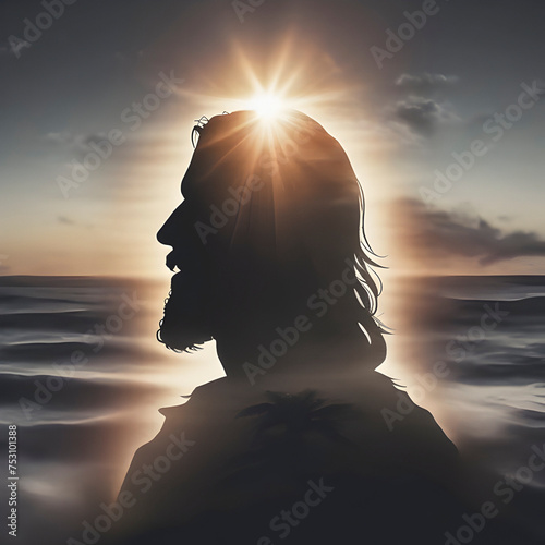 Jesus Christ silhouette with the sunset coast. photo