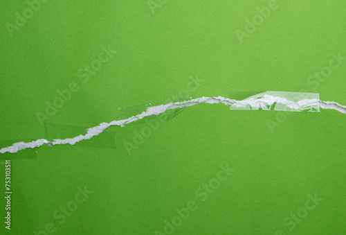 Torn green paper with transparent adhesive tape or strips,repair paper