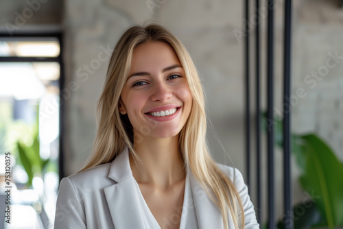 Portrait of smiling young businesswoman with blonde hair, Happy female employee, professional confident woman at office, smiling business woman wallpaper concept, female Portrait at co-working space Free Download Portrait of smiling young businesswoman with blonde hair, Happy female employee, professional confident woman at office, smiling business woman wallpaper concept, female Portrait at co-working space - GFXLoad