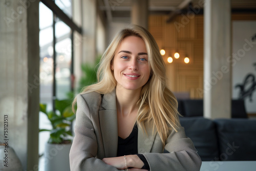 Portrait of smiling young businesswoman with blonde hair, Happy female employee, professional confident woman at modern office, Smiling business woman wallpaper concept, woman wearing blazer in office Free Download Portrait of smiling young businesswoman with blonde hair, Happy female employee, professional confident woman at modern office, Smiling business woman wallpaper concept, woman wearing blazer in office - GFXLoad