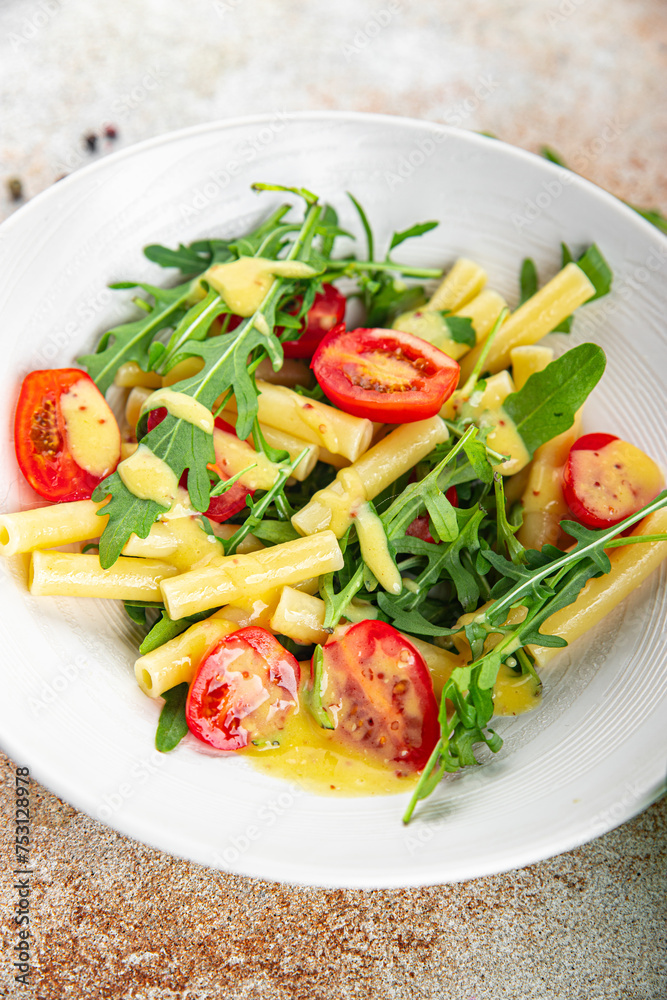 pasta salad tomato, arugula fresh food tasty eating cooking appetizer meal food snack on the table copy space food background rustic top view