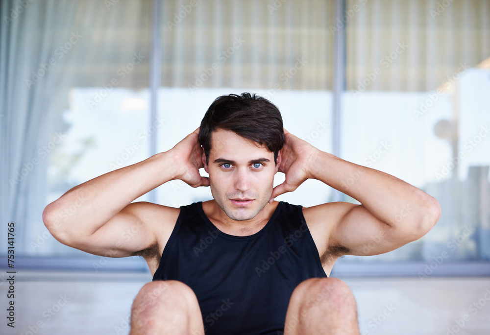 Man, portrait and sit ups for fitness, core training for body and self care in apartment. Serious athlete, exercise and endurance in workout for health, wellness for sports and challenge at home Man, portrait and sit ups for fitness, core training for body and self care in apartment. Serious athlete, exercise and endurance in workout for health, wellness for sports and challenge at home