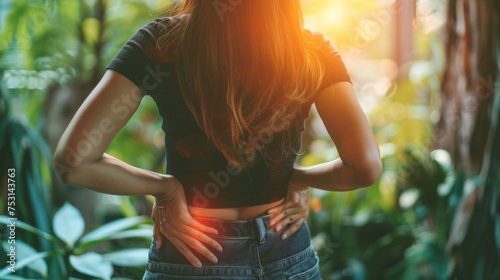  woman holding her lower back while and suffer from unbearable pain health and problems, chronic back pain, backache in office syndrome, scoliosis, herniated disc, muscle inflammation
