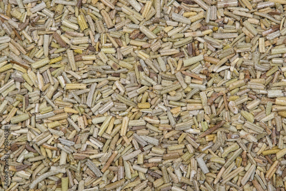 Crushed Rosemary herbs background image. Salvia rosmarinus aromatic herb used in many recipes and traditional folk medicine.