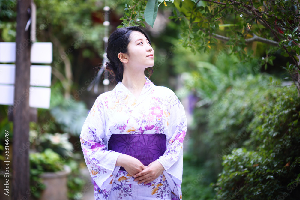 portrait woman with yukata dress in the garden portrait woman with yukata dress in the garden